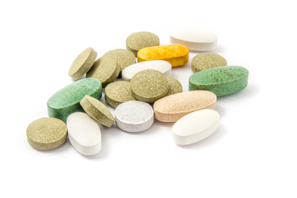 Vitamins on white background